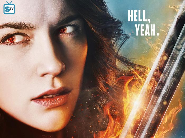 Wynonna Earp with fiery eyes and sword