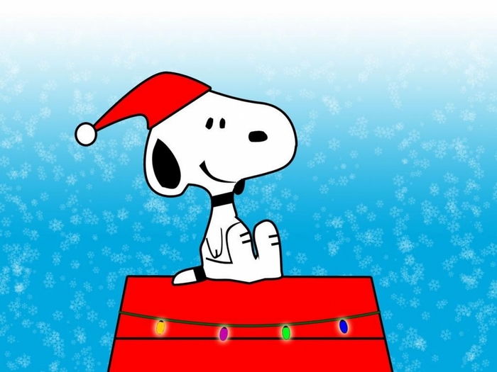 Snoopy wearing a Santa hat on a red dog house