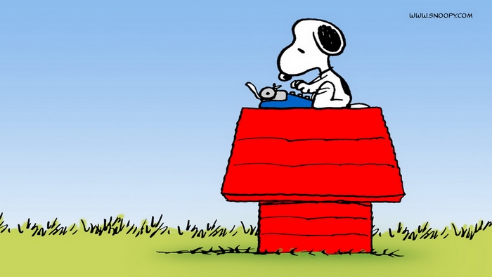Snoopy typing on a typewriter on his doghouse