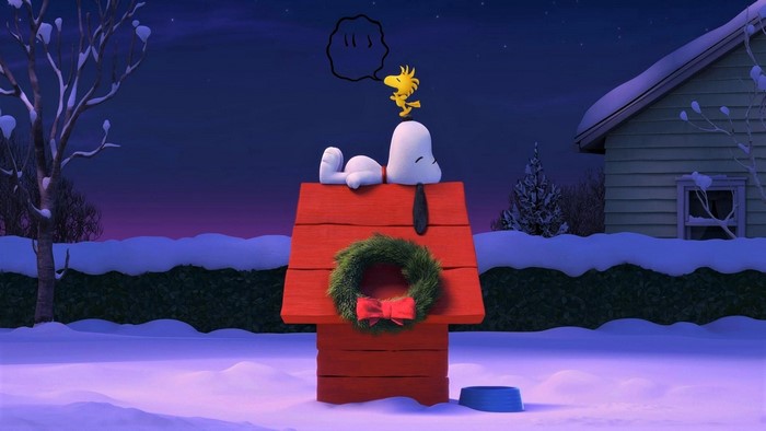 Snoopy and Woodstock on a doghouse in winter