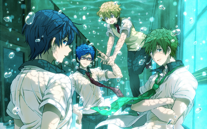 Four boys in swim uniforms underwater