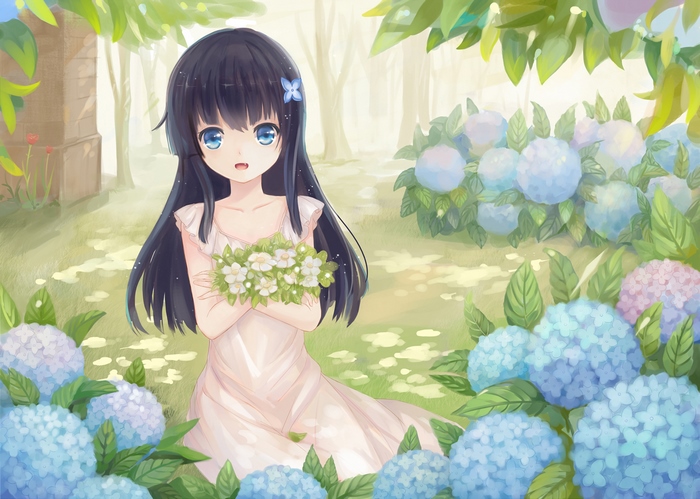 Girl with flowers in a garden