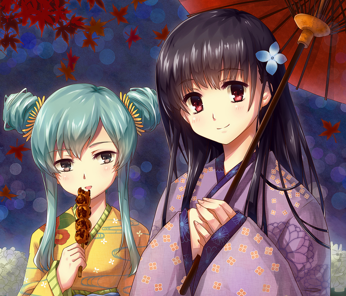 Two girls in kimonos eating dango
