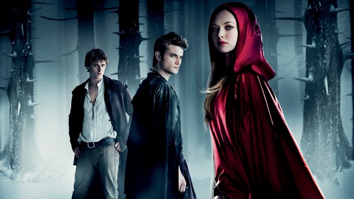 Red Riding Hood and two men in a forest