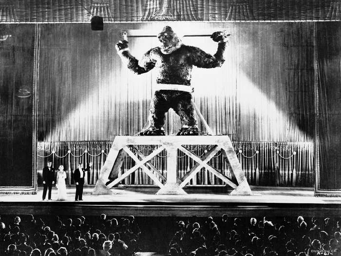 King Kong on stage with performers and audience