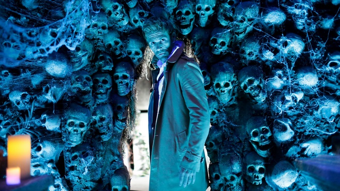 John Constantine surrounded by skulls