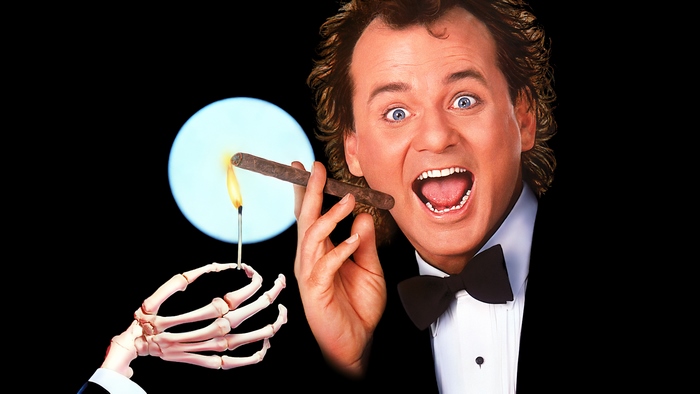Bill Murray lighting a cigar with a match