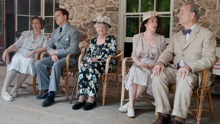 Bill Murray and others sitting on chairs
