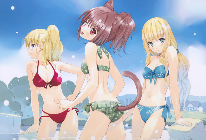 Three girls in bikinis in water