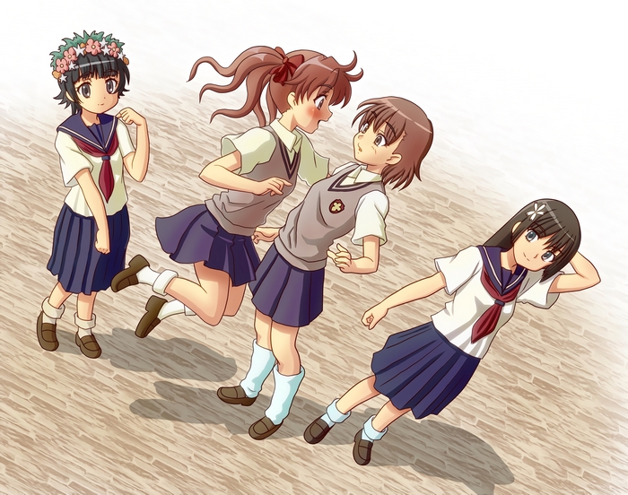 Four girls in school uniforms on a wooden floor