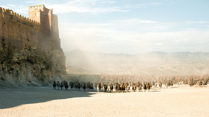 Army of horsemen approaching a fortress