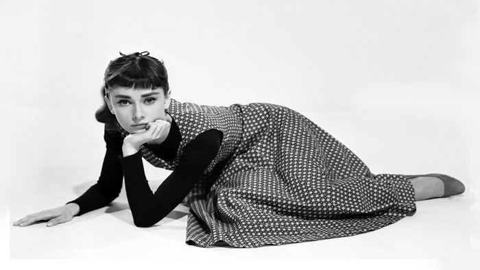 Audrey Hepburn posing on the floor