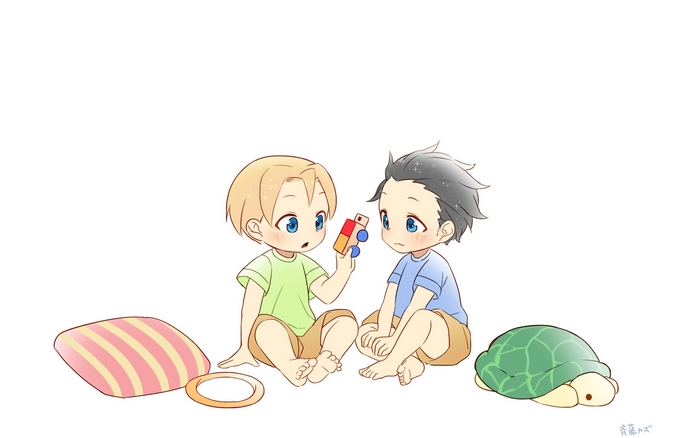 Two young boys playing with toys
