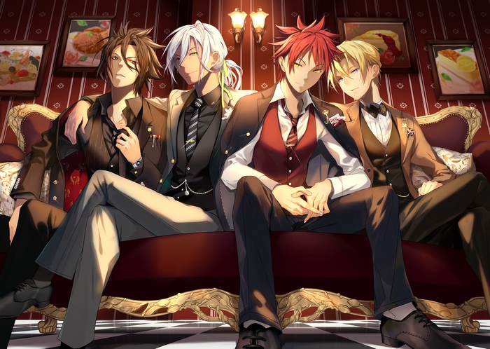 Four men in suits sitting on a couch