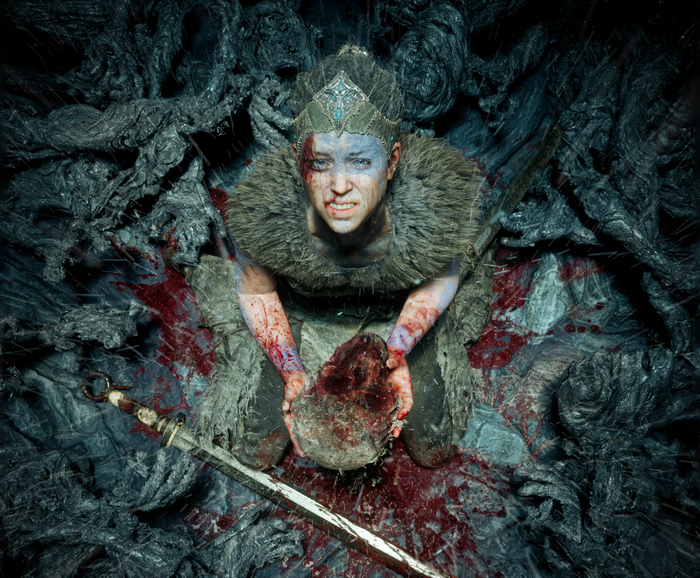 Senua from Hellblade holding a severed head