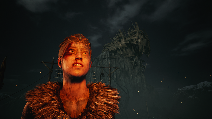 Senua from Hellblade in a dark, ominous landscape
