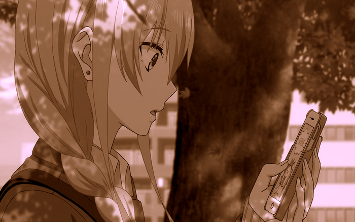 Yuzu Aihara holding a smartphone