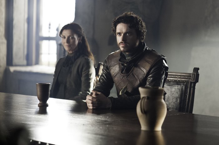 Catelyn Stark and Robb Stark sitting at a table