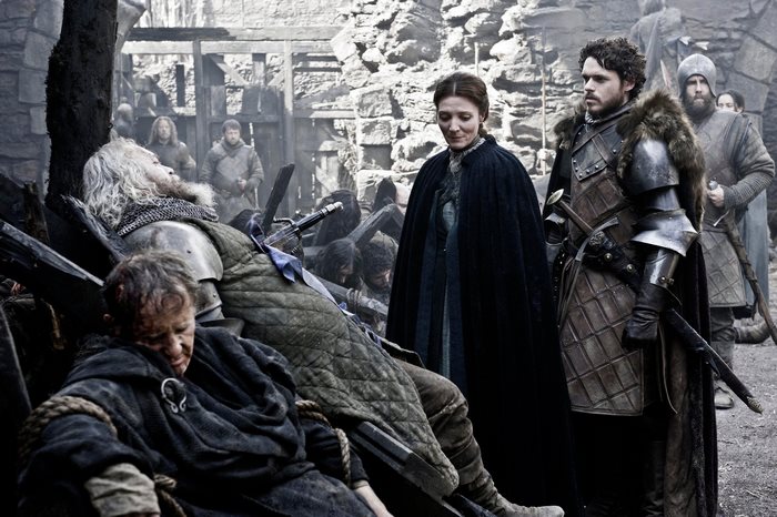 Catelyn Stark and soldiers at a battle aftermath