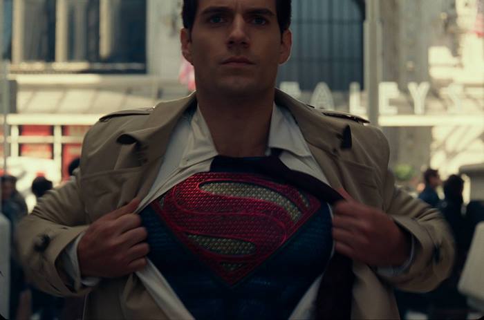 Superman from DC Comics revealing his suit
