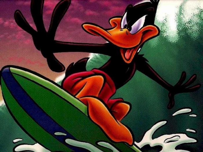 Daffy Duck surfing on a wave