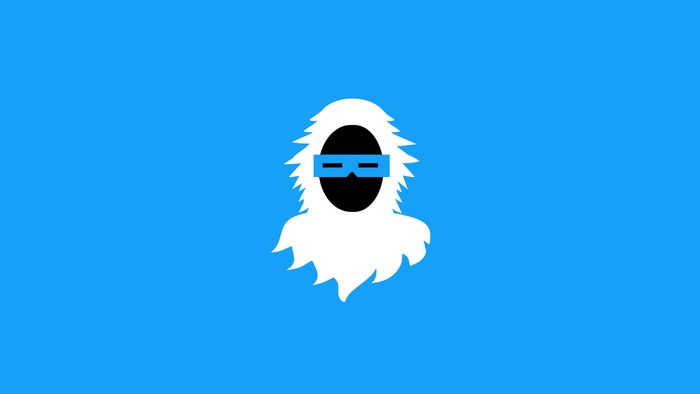 Yeti wearing goggles on blue background