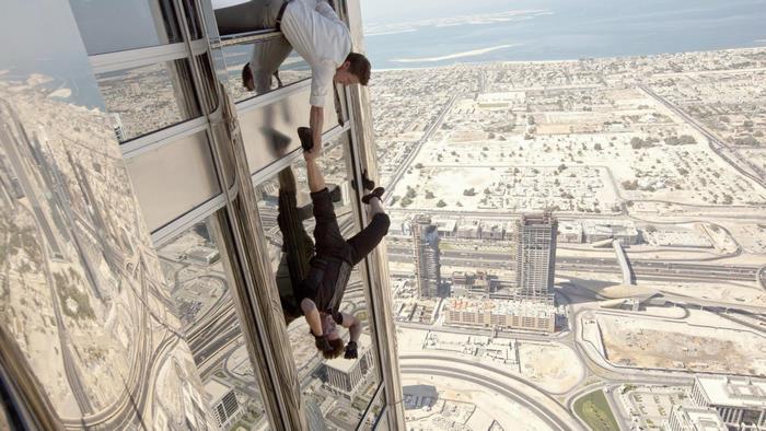 Ethan Hunt hanging from a skyscraper