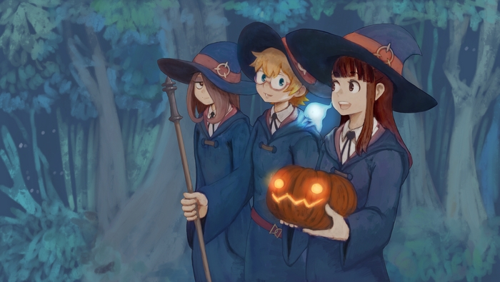 Three witches with a pumpkin in a forest