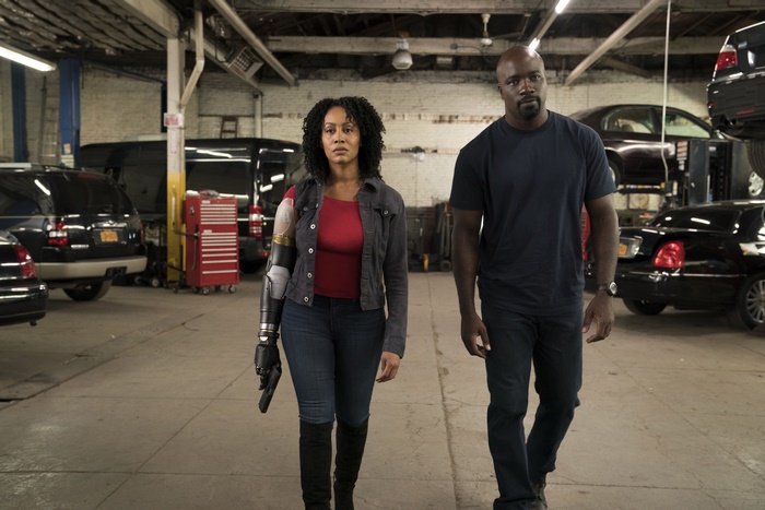 Luke Cage and Misty Knight in a garage