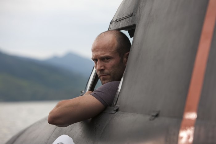 Jason Statham in a vehicle