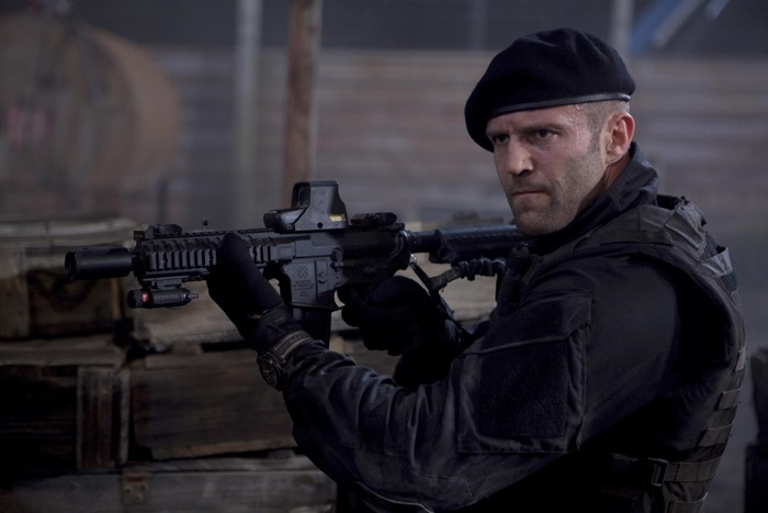 Lee Christmas holding a rifle