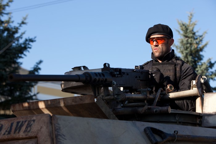 Lee Christmas from The Expendables with a machine gun