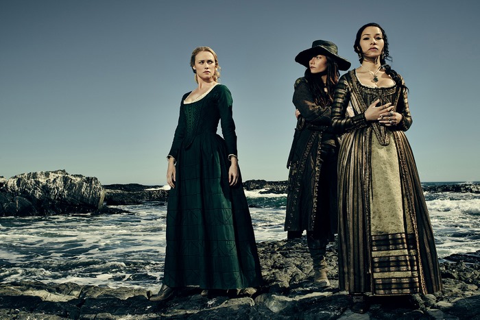 Eleanor Guthrie and two women on a rocky shore