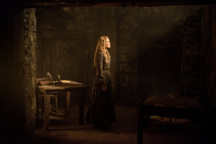 Eleanor Guthrie in a dimly lit room