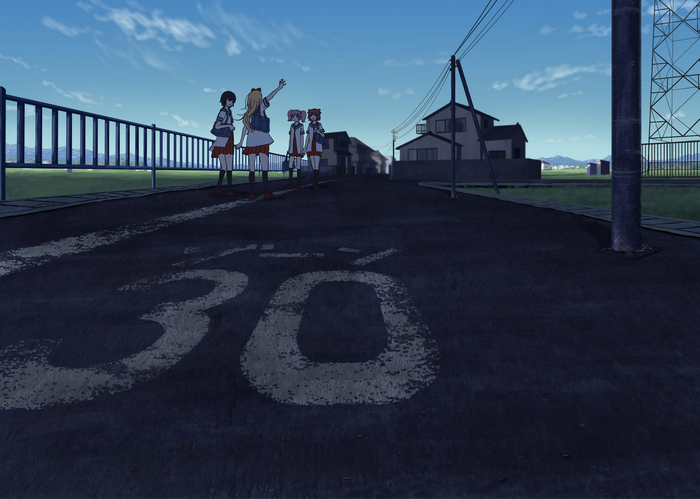 Four schoolgirls on a road with speed limit sign