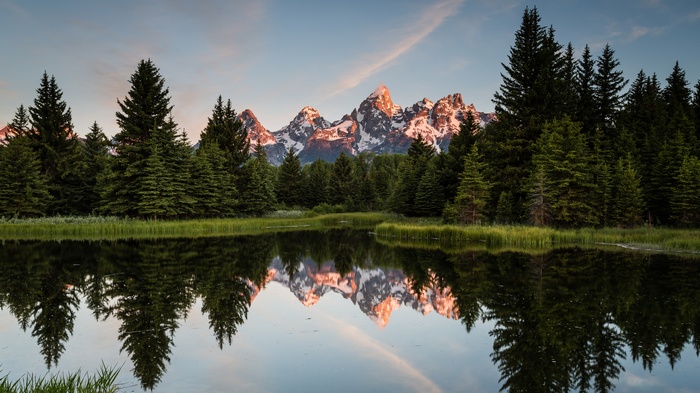 Grand Teton Mountains reflected in a calm lake
