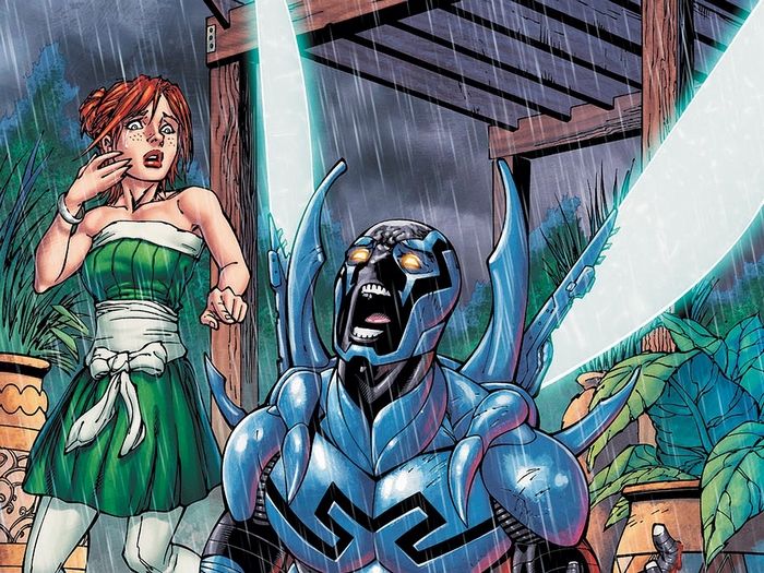 Blue Beetle and a distressed woman in the rain