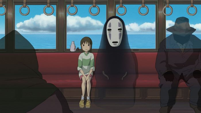 Chihiro and No-Face on a train from Spirited Away
