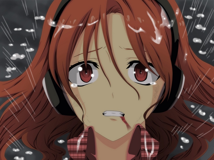 Girl with headphones crying in the rain