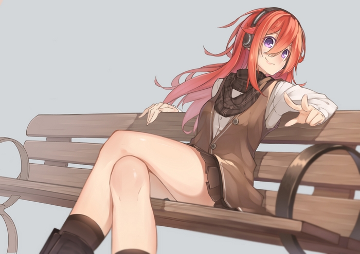 Girl with headphones sitting on a bench