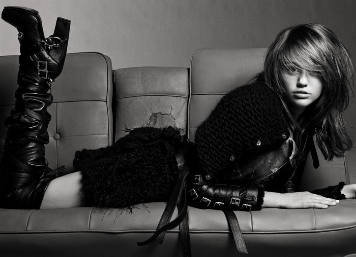 Miley Cyrus on a couch