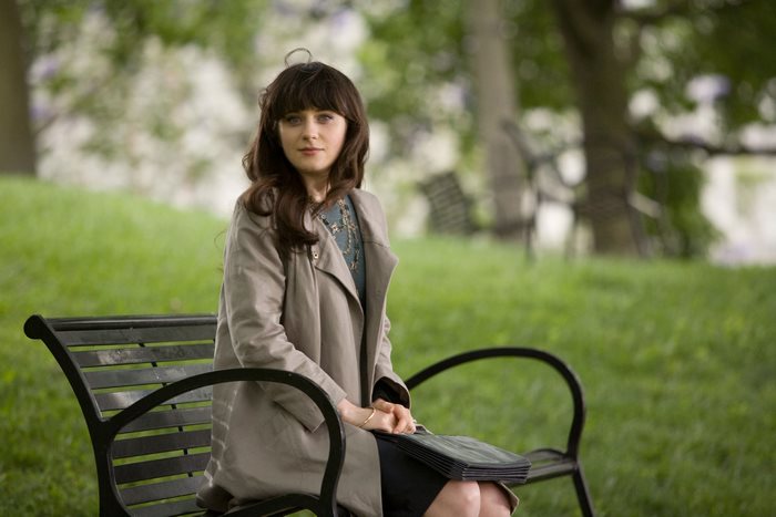 Summer Finn sitting on a park bench