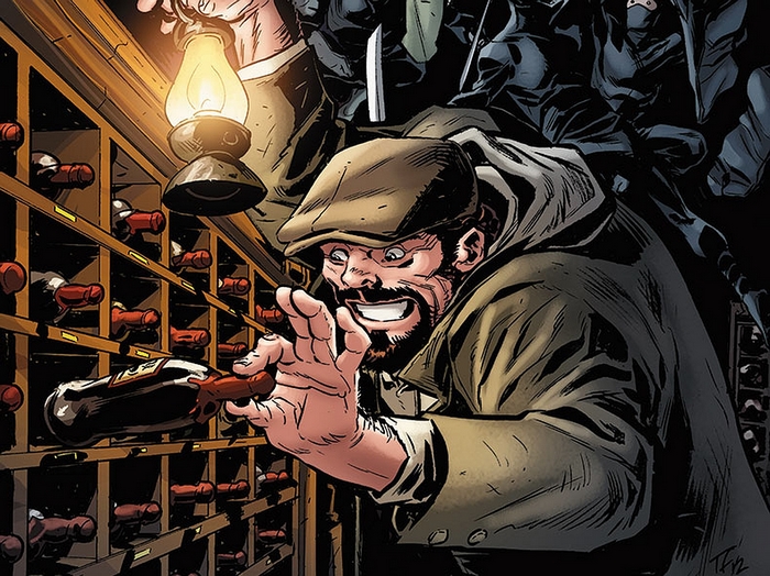 Man in a cellar with a lantern and wine bottles