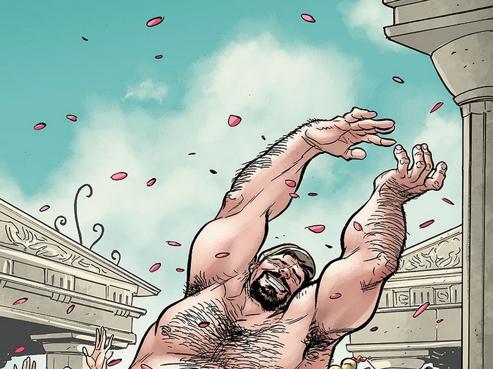 Man with arms raised amidst falling petals