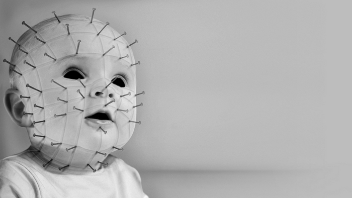 Baby with nails on face