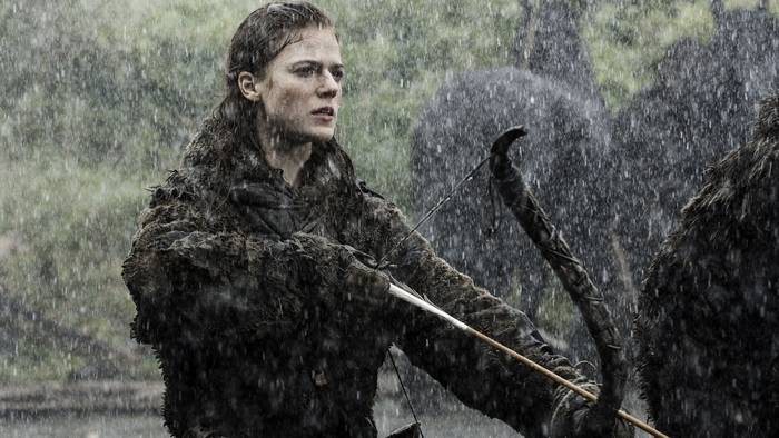 Ygritte from Game of Thrones aiming a bow in the rain