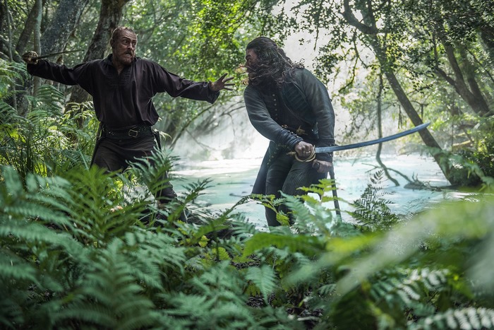 John Silver from Black Sails in a forest