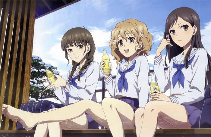 Three girls in sailor uniforms with drinks
