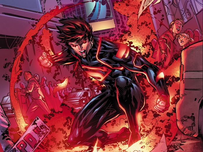 Superboy in a black and red suit surrounded by red energy