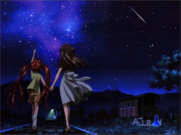 Two girls looking at a starry night sky